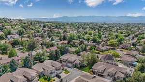 Aerial perspective of suburban area featuring a mountain backdrop