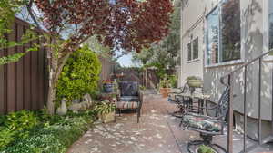 Fenced backyard with a patio