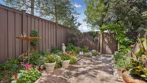 Fenced backyard with a patio