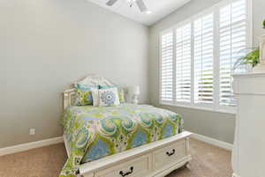 Bedroom featuring carpet and ceiling fan