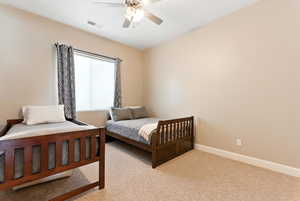 Bedroom with light carpet and ceiling fan