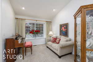 Sitting room featuring carpet floors, lofted ceiling, and recessed lighting