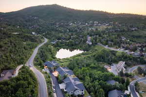 Aerial view of property's location with nearby suburban area and a mountain backdrop