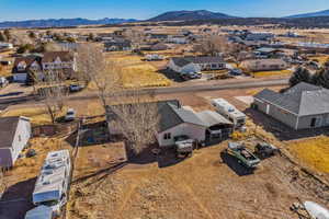 Aerial perspective of suburban area with a mountainous background