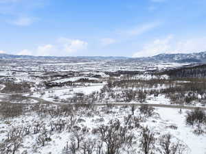 Snowy aerial view with a mountain view