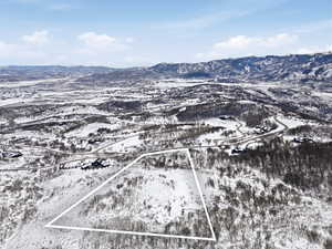 Snowy aerial view with property boundaries highlighted and a mountain viewhttps://www.utahrealestate.com/lip/photo/listno/2095871#