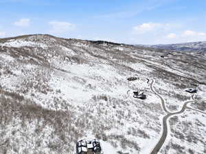 Snowy aerial view featuring a mountain view