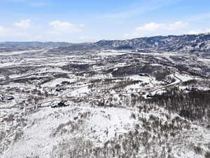 Snowy aerial view featuring a mountain view