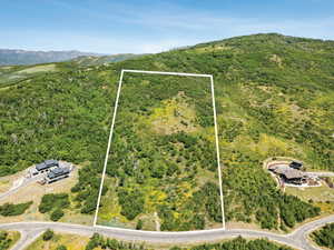 View of property location featuring property boundaries highlighted and a mountain backdrop