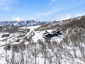 Snowy aerial view featuring a mountain view