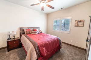 Bedroom with carpet flooring and a ceiling fan