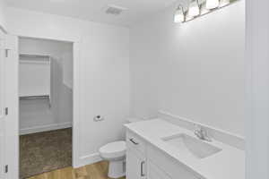 Bathroom with vanity and wood finished floors