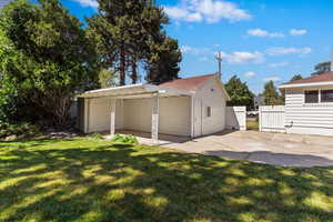 Garage featuring a carport