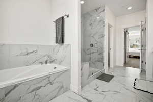 Ensuite bathroom with a garden tub, a marble finish shower, marble finish floors, and recessed lighting