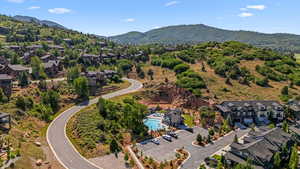 Aerial view of residential area featuring a mountainous background