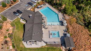 View of subject property featuring a pool area