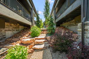 View of yard featuring a balcony