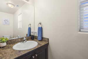Bathroom with vanity and toilet
