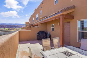 View of patio / terrace featuring a mountain view and outdoor dining space