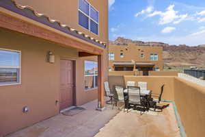 View of patio / terrace with outdoor dining area and a mountain view