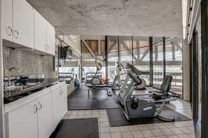 Exercise room featuring expansive windows and plenty of natural light