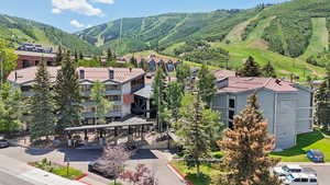 Aerial perspective of suburban area with a mountainous background