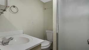 Bathroom with vanity and a shower
