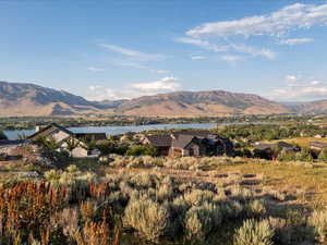 View of mountain backdrop with a nearby body of water