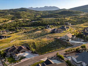 View of property location featuring a mountainous background and nearby suburban area