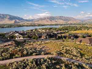 Mountain view featuring a nearby body of water and nearby suburban area