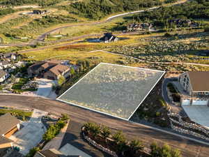 Aerial view of residential area with property parcel outlined
