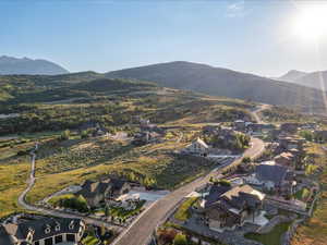 View of property location with mountains and nearby suburban area
