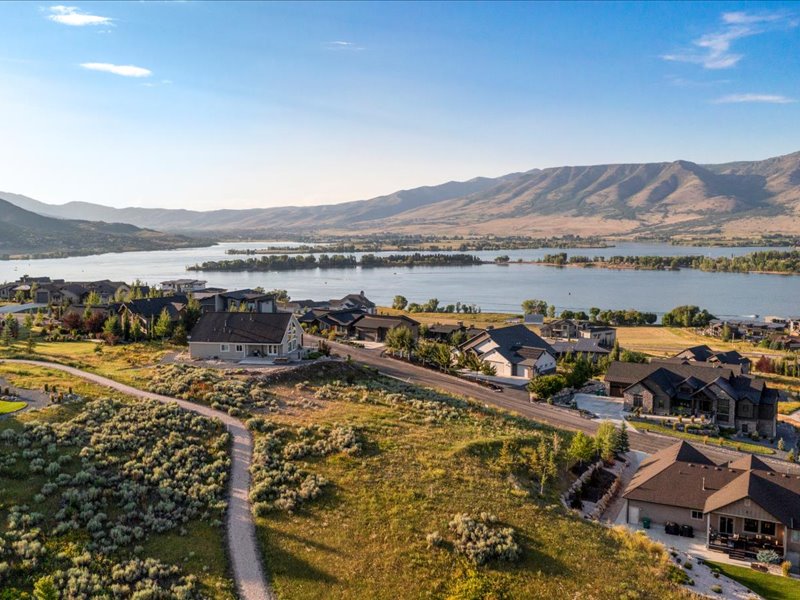 Aerial view of residential area featuring a water and mountain view