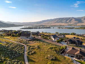 Aerial view of residential area featuring a water and mountain view
