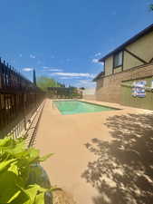 View of pool with a patio area
