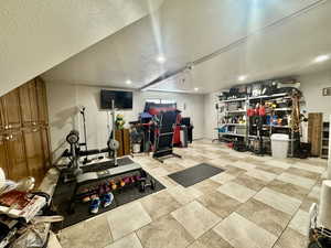 Exercise area featuring recessed lighting