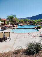 Community pool with a mountain view and a patio