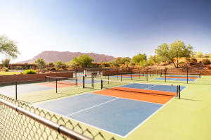 View of tennis court featuring community basketball court and a mountain view