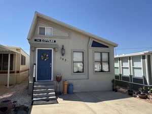 View of front facade with stucco siding
