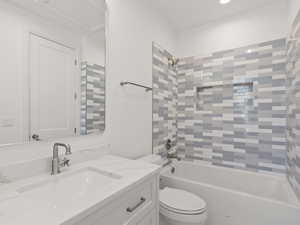 Bathroom with shower / bath combination and vanity