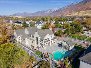 Drone / aerial view of a mountainous background and a pool area