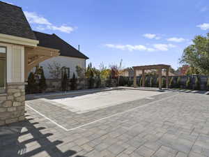 View of swimming pool with a pergola and a patio