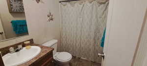 Full bath featuring vanity, backsplash, curtained shower, and tile patterned floors
