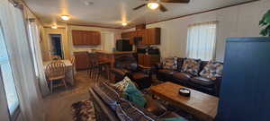 Living area featuring ceiling fan