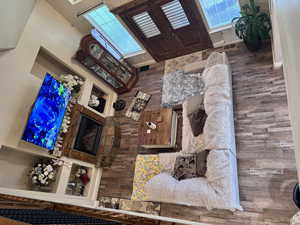 Living room featuring wood finished floors and healthy amount of natural light