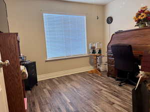 Home office with wood finished floors