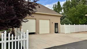 Garage with concrete driveway