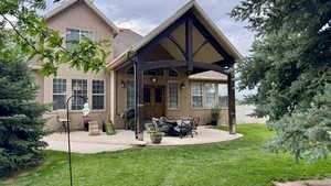 Back of property with french doors, stucco, and a patio area