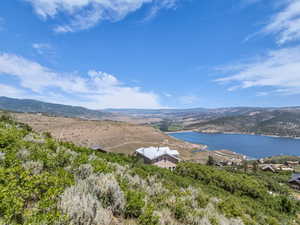 View of mountain backdrop with a large body of water