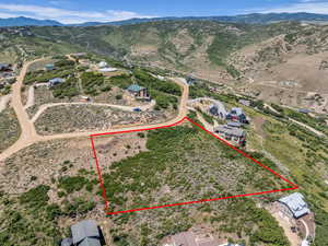 View of property location with property boundaries highlighted and a mountainous background